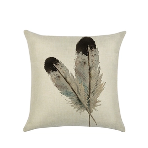 Linen cushion cover with watercolor feather pattern on a white background for sofa decor