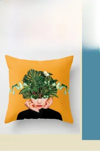 Detail of digital print cushion cover with floral portrait on yellow fabric
