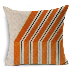 Detail view of the beige linen pillowcase with modern orange and white geometric patterns