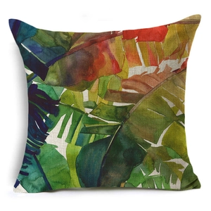 Close-up of tropical banana leaf pattern on linen cushion cover with vivid colors