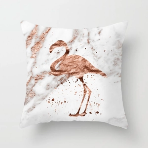 Detail of flamingo silhouette in rose gold on marble peach skin cushion cover