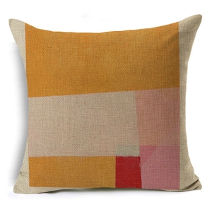 Close-up of modern abstract geometric pillow case with yellow and beige linen texture