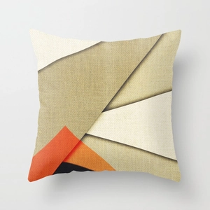 Detailed close-up showing thick linen texture and geometric patterns on abstract pillow cover