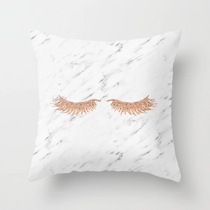 Detail of marble pattern cushion cover with rose gold glitter eyelash design decoration