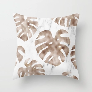 Detail of rose gold monstera leaf pattern on marble texture peach skin pillowcase