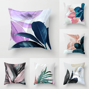 Detail of tropical plant leaf patterns on decorative peach skin pillow cases