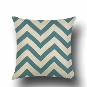 Close-up of square cushion cover featuring blue and cream chevron wave patterns