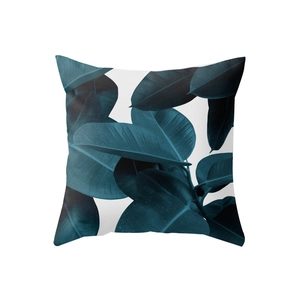 Square peach skin throw pillow case with deep teal tropical leaf pattern on white background