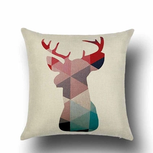 Close-up of linen pillow cover showing woven texture and colorful geometric deer pattern