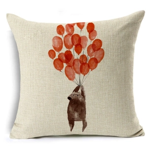 Close-up of linen pillow cover showing red balloons with bear watercolor print texture