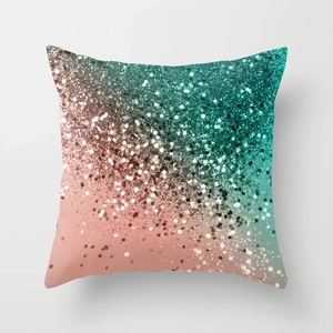 Macro detail of the shimmering sequins on the turquoise to orange gradient pillow cover