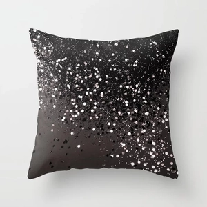 Detailed macro shot of silver glitter gradient pattern on modern black polyester pillow case