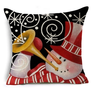 Detail of linen Christmas pillowcase showing a snowman playing trumpet on black fabric