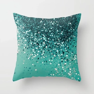Detail of teal gradient decorative pillow cover with shiny silver and blue sequin pattern