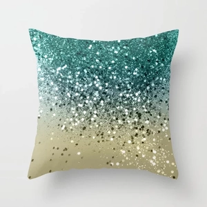 Macro detail of decorative pillow cover with teal to gold shimmer gradient effect