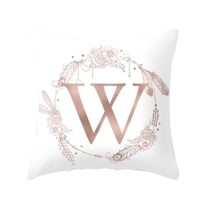 Modern peach skin pillowcase featuring a rose gold letter W with a floral bohemian wreath