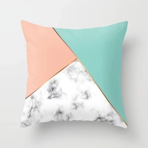 Detail of pink marble geometric throw pillow cover with golden stripe and peach skin texture