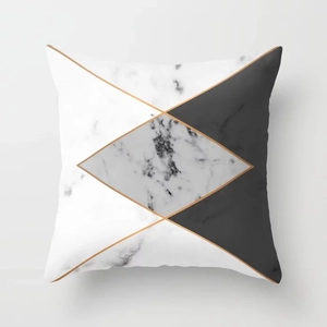 Detail view of geometric marble pattern and gold line stitching on pink throw pillow cover