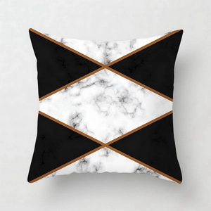 Close-up of geometric pink marble pattern on square peach skin pillowcase with gold lines