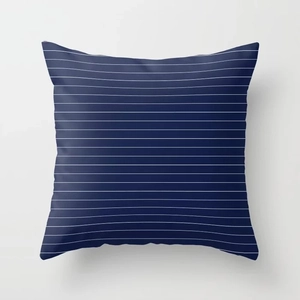 Detail of square navy blue pillowcase with thin white horizontal stripes and soft fabric