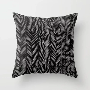 Detail of modern black and white geometric herringbone pattern on polyester pillow cover