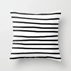 Close-up of minimalist black hand-drawn stripes on white polyester peach skin cushion cover