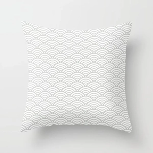 Detail of square cushion cover with grey and white Seigaiha wave pattern and neat stitching