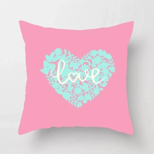 Detailed view of pink peach skin pillowcase with floral heart pattern and love typography