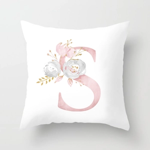 Detailed view of white peach skin pillowcase with watercolor letter S and floral patterns