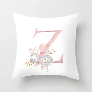 Detail view of square pillowcase with letter Z and pink watercolor floral pattern