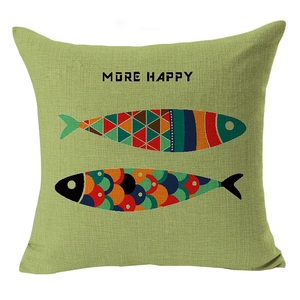 Linen cushion cover with colorful geometric fish patterns and More Happy lettering