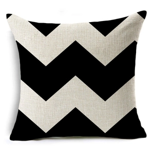 Detailed texture of black and white chevron geometric wave pattern on linen pillowcase