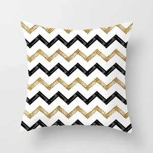 Detail of peach skin pillowcase with gold waves and black geometric stripes on white