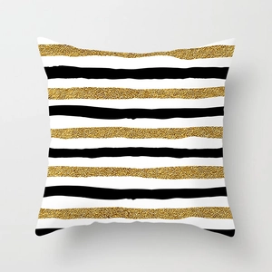 Detailed view of modern gold foil stripes and black geometric pattern on soft peach skin pillowcase