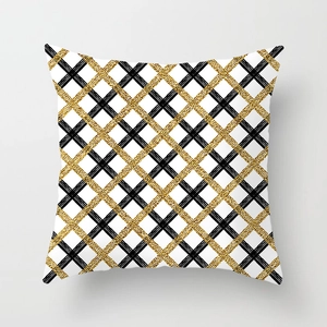 Detail of square pillowcase with golden glitter geometric grid and black cross patterns
