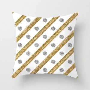 Macro shot of geometric gold glitter stripes and silver dots on microfiber pillow cover