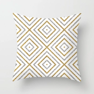 Detailed view of geometric diamond pattern with gold and silver glitter on pillowcase