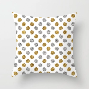 Detail showing gold and silver foil polka dots on a white peach skin pillowcase texture