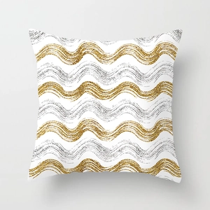 Detail of white pillowcase with golden and silver sequin wave patterns and grainy texture