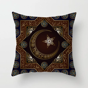 Macro detail of Ramadan pillow cover with golden crescent moon and Islamic art patterns