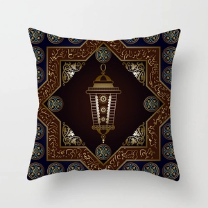 Close-up of golden Islamic lantern and Arabic calligraphy on navy peach skin pillow cover