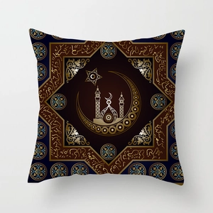 Detail of navy blue pillowcase with golden moon, stars, and mosque silhouette patterns