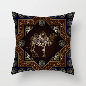 Detail of square pillowcase with golden camel, Arabic calligraphy, and mandala patterns