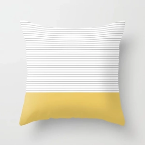 Detail of yellow and black striped geometric pattern on square decorative pillow cover