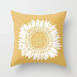 Detailed close-up of yellow pillowcase featuring a large white sunflower print on soft fabric