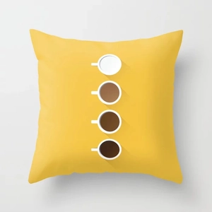 Detail of yellow throw pillow cover featuring artistic coffee cup gradient graphics