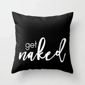 Detailed close-up of a black square pillowcase featuring white Get Naked printed text