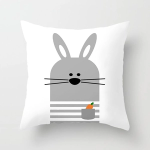 Close-up of decorative pillowcase with gray cartoon rabbit and small carrot pocket