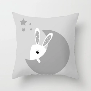 Detail of cartoon white rabbit on grey moon print on square cushion cover fabric
