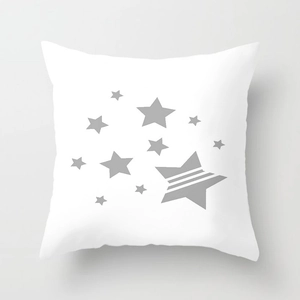 Detail of white square pillowcase featuring a minimalist dark grey star pattern design